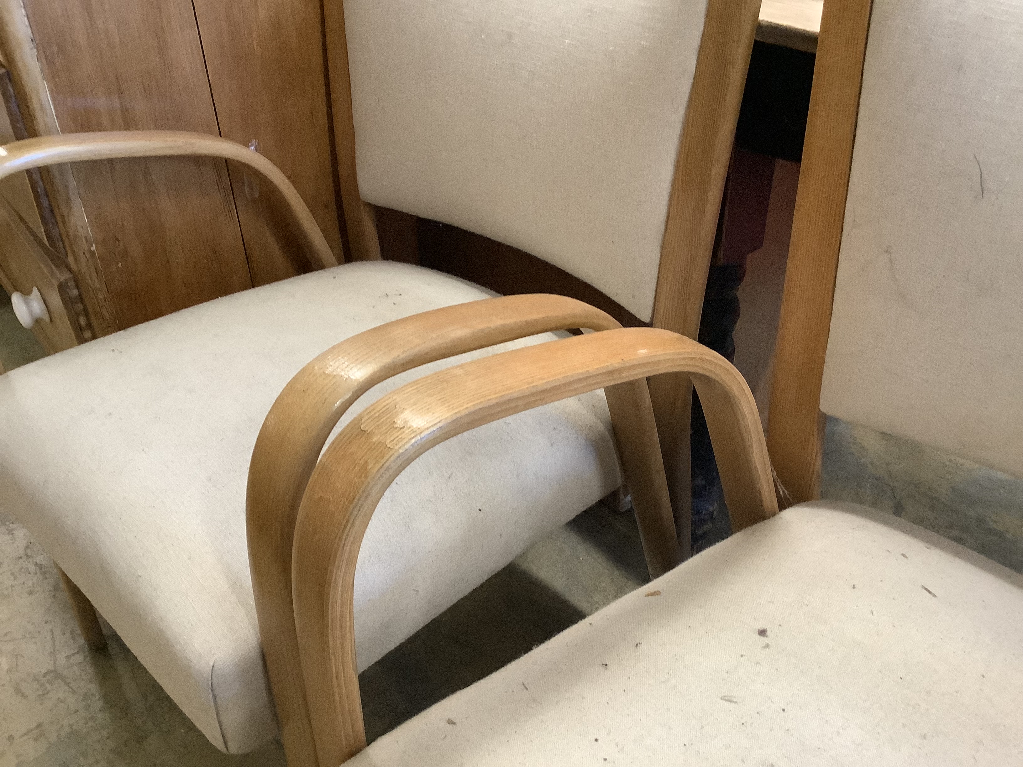 A pair of mid century elbow chairs